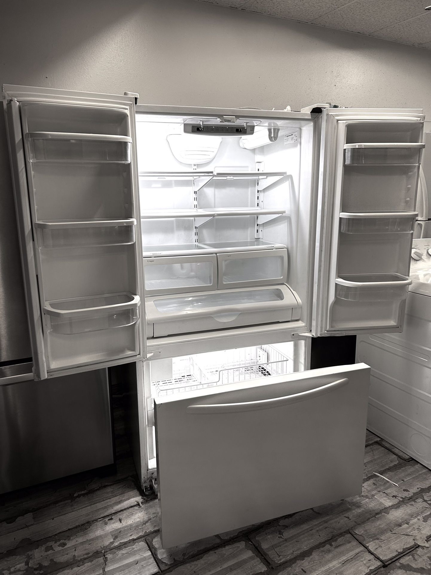 A Kitchen Aid White Refrigerator