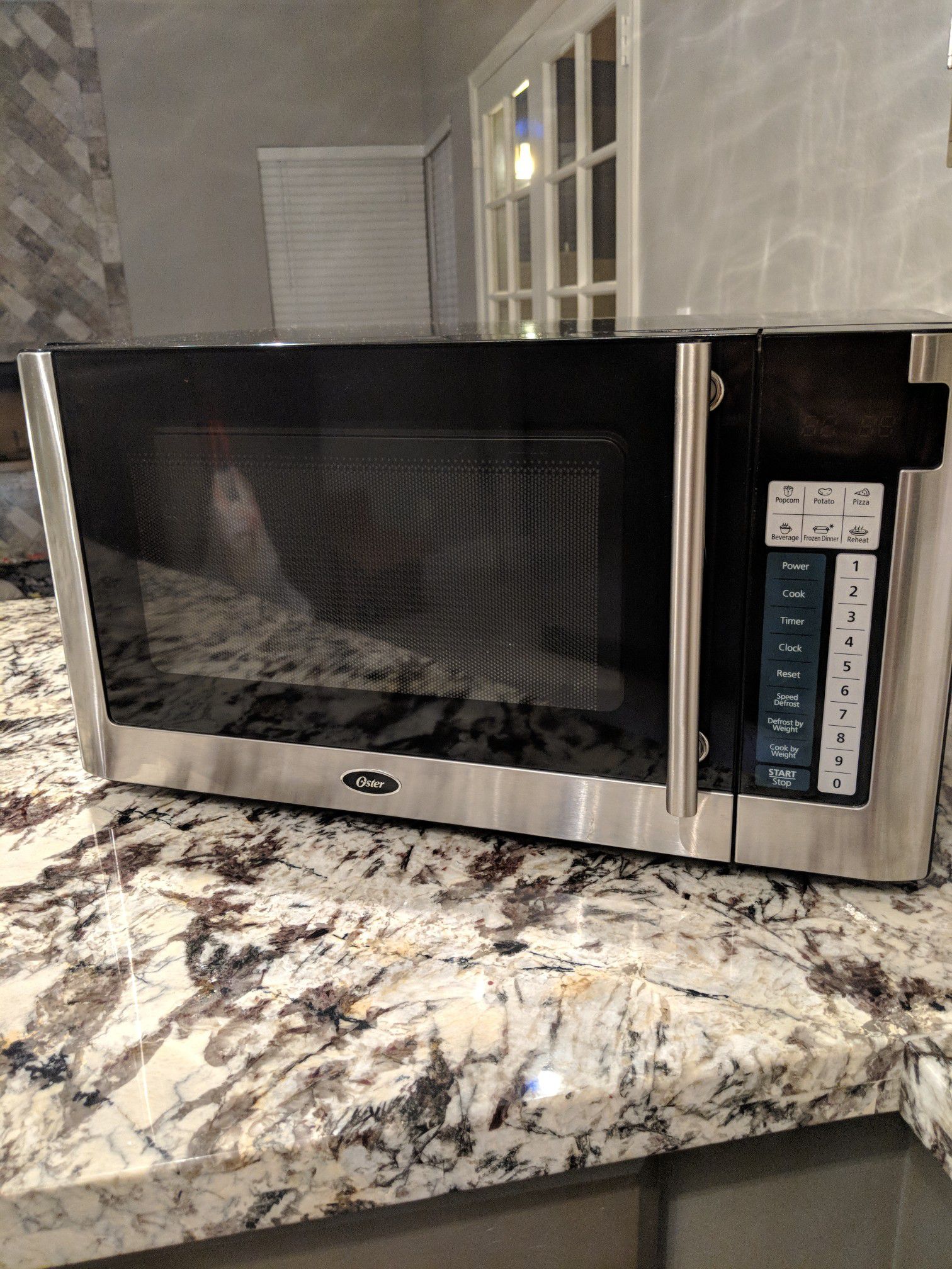 Oster 1.1cu. ft. Microwave Stainless Steel - American Stores