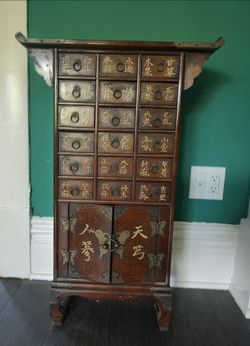 are Antique Korean Wooden Apothecary Chest – 18 Drawers with Brass Hardware