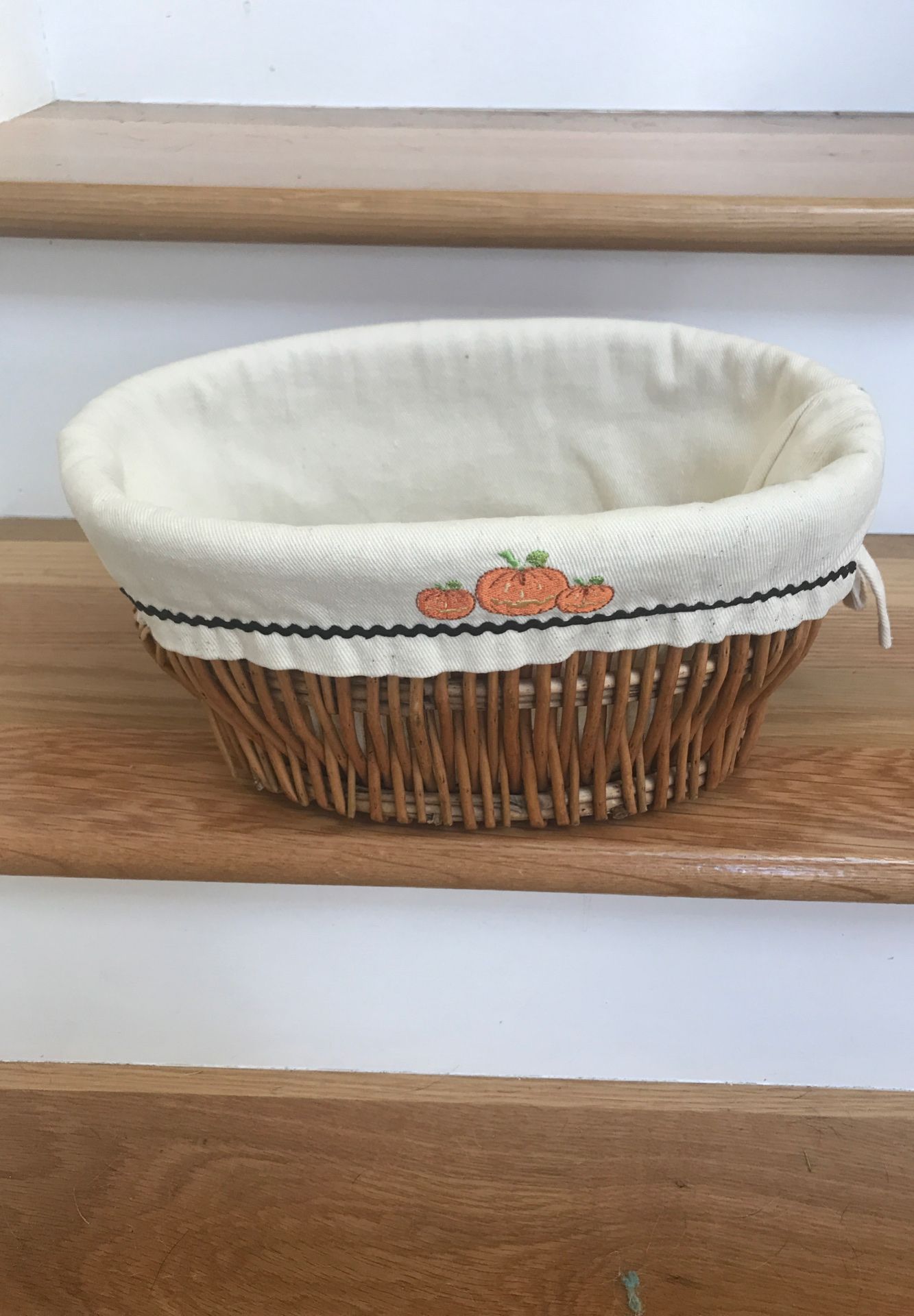 Wicker Basket-Liner with pumpkins.