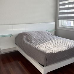 Full size bed and built in headboard with nightstands