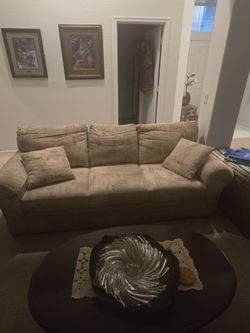 Tan Fabric Three-Seat Sofa with Pillows
