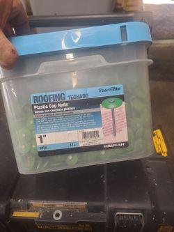 Tub of 1 inch plastic cap nails