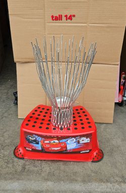 14" Tall Beautiful metal candle holder.
