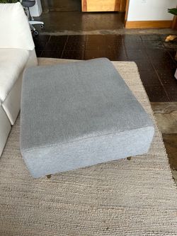 Large Gray Upholstered Ottoman with Wood Legs