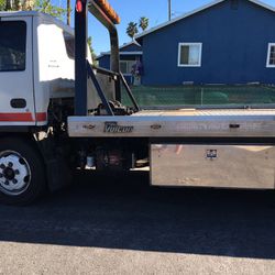 Flatbed rollback tow truck great condition low mileage cold air conditioning with everything needed to start working today All parts work  great
