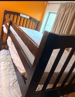 Bunk bed with mattress and ladder