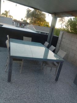 USED outdoor grey patio table with chairs