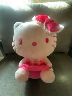 Hello kitty pink bow and dress.