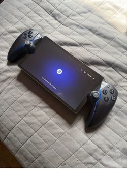 Sony PlayStation Handheld Console with Black and Blue Grip Controllers