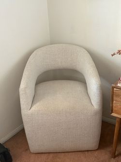 Cream accent chair with casters