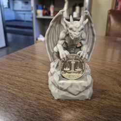 .999  1oz silver round with gargoyle display.