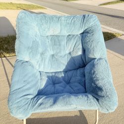 Selling a blue furry chair.