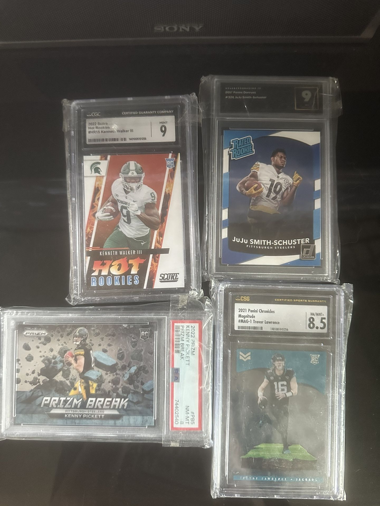 4 football graded cards