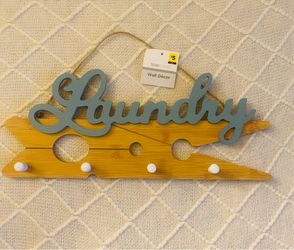 Brand new laundry, sign with pegs