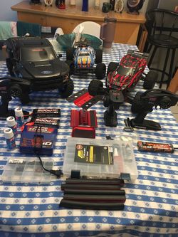 Traxxas Rustler 4X4 1/10 scale PLUS Traxxas Ford Raptor Slash 2WD RC truck. Plus EVERYTHING you see in pictures. (TRADE???) Both have upgrades. BONUS 