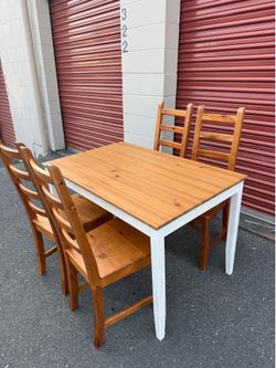 Ikea wooden table and four chairs