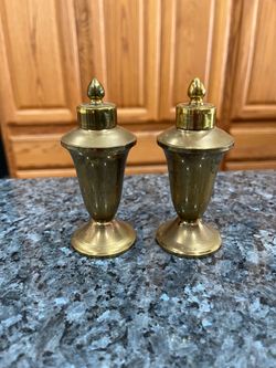 Vintage Brass Urn with Twist Top Pair of Salt and Pepper Shakers.  Size approximately 4 1/2 inches tall.  Preowned.  The shakers need to be cleaned wi