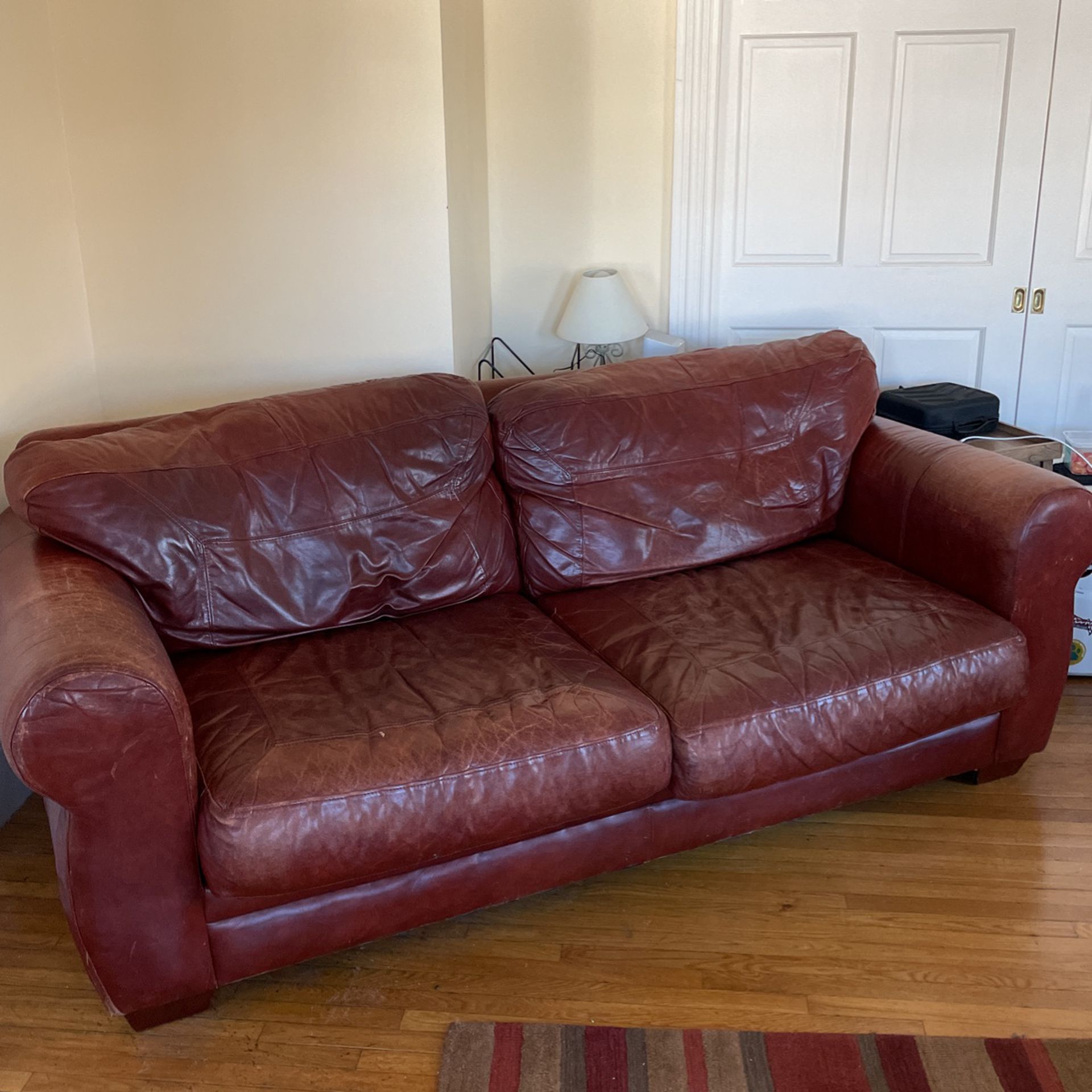 Red leather couch & chair with footrest