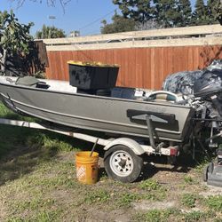 Small Boat With Out Board And Trolling Motor 