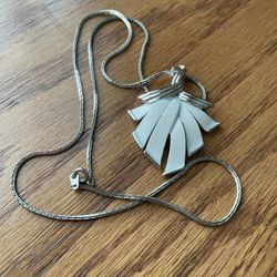 White and Silvertone Antique pendant on Sterling chain