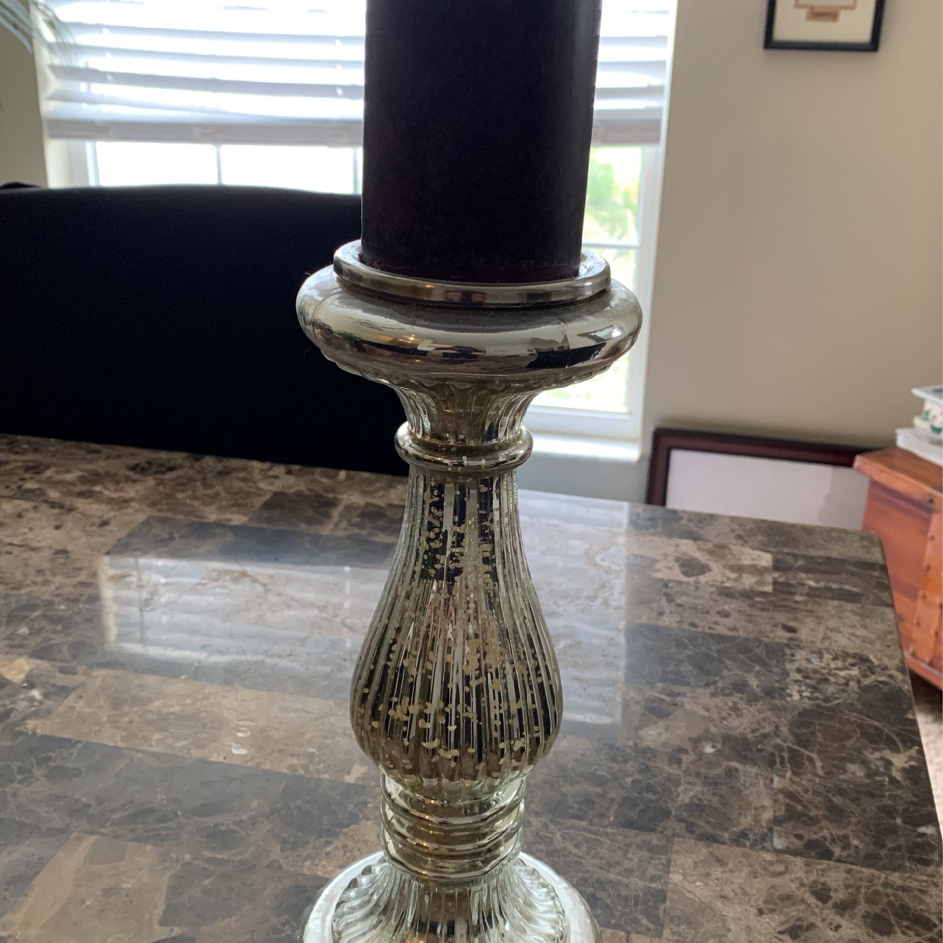Tall candleholder Pillar with a big purple candle