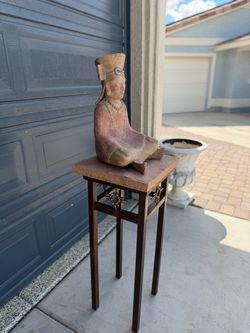 Buddha stone on a stand