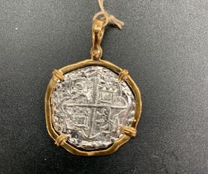 Atocha silver coin pendant in gold bezel