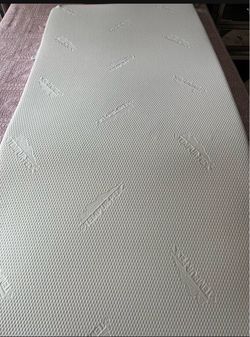 Tempur-Pedic twin mattress, 3 inches thick, made of foam.