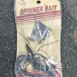This is a WAZP brand 1/2 oz black spinner bait fishing lure in original packaging