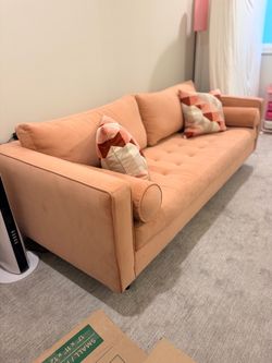 Dust Pink Tufted Sofa with Bolster Pillows