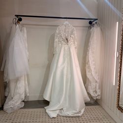 Elegant White Lace-Back Long Sleeve Wedding Gown