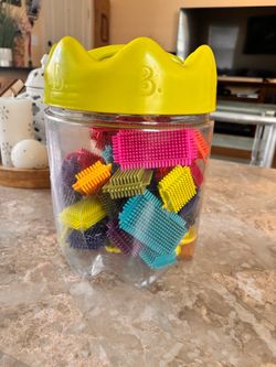 B. Toys Bristle Blocks in Crown Canister