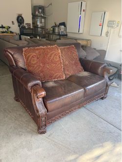 Ornate Carved Wood and Brown Leather Loveseat
