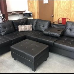 Heights Black Faux Leather Reversible Sectional with Storage Ottoman