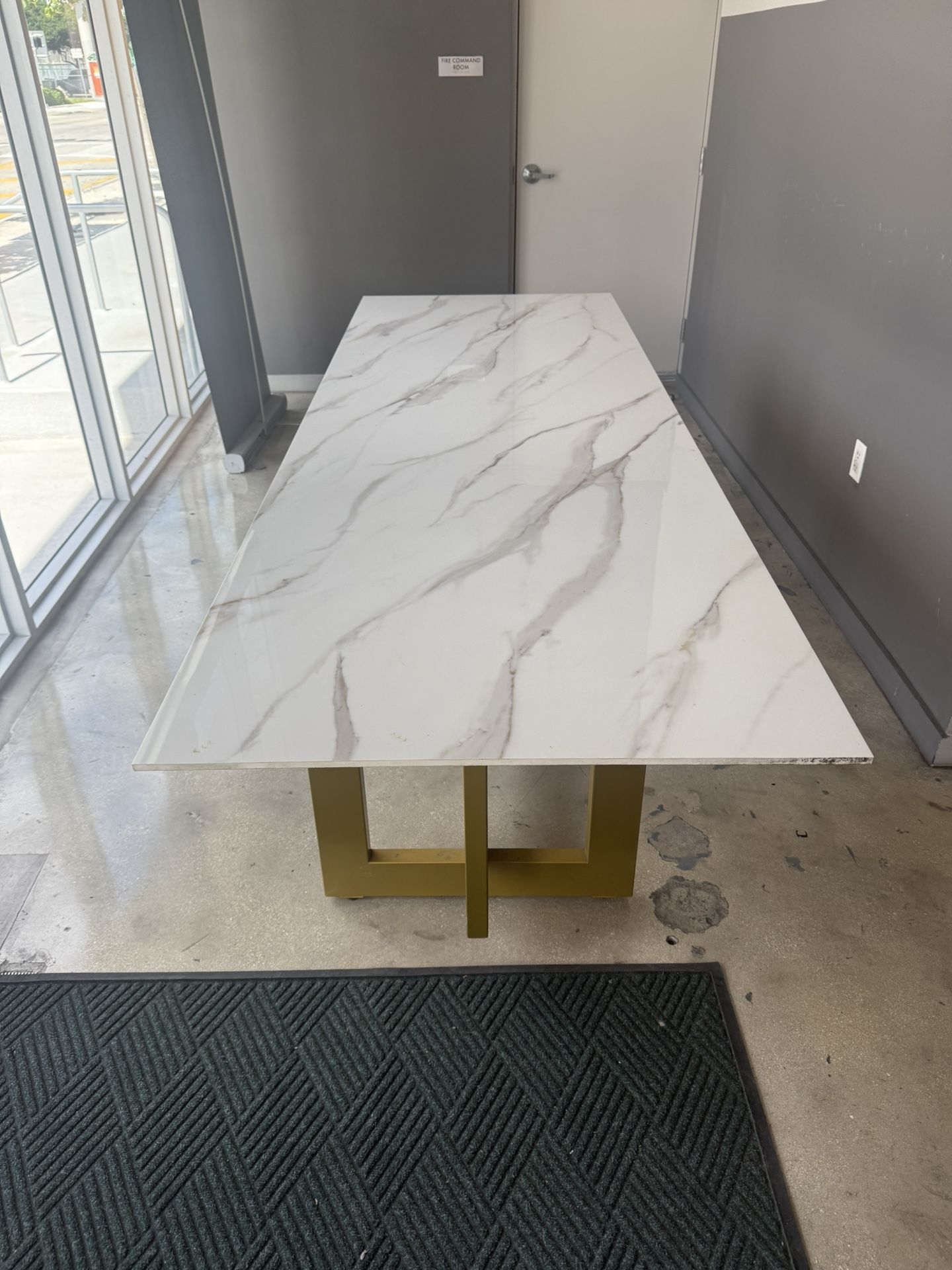Calacata porcelain table with golden iron base.