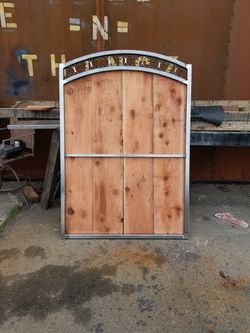 Custom steel gates with integrated wooden planks