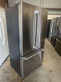 Luxury Counter depth Café with indoor water and icemaker Cafe 23.1 cu.ft. Smart French Door Refrigerator - Stainless Steel Retail price $3269