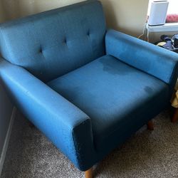large mid century modern style chair and ottoman