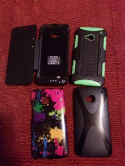 3 HTC One phone casesI will sell them separately make me an offer on one or all the black one is a charger