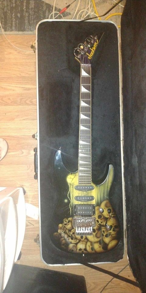 Jackson SL1 Soloist Electric Guitar ---pile 'o Skulls Artwork