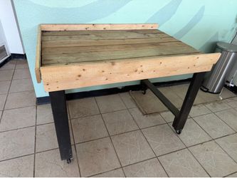 Wooden work table on wheels