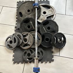 Olympic weights 210lbs total plus curl bar with clamps