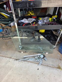 Honda CRV passenger front window Rail and motor.
