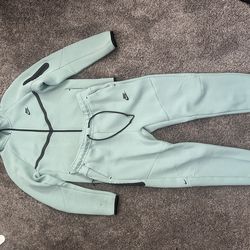 Teal nike tech suit