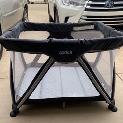 Aprica travel crib deals