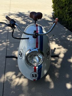 Fusconeta "Volkspod" mini bike custom-painted in a Herbie “the love bug” theme.