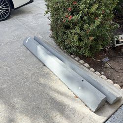 2 concrete parking blocks