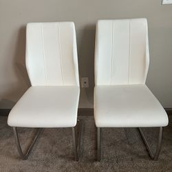 2 Chairs, white faux leather , metal bottom, 