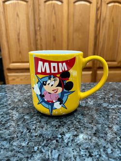 Disney Minnie Mouse Coffee Cup Mug.  The cup says “Mom”.  Capacity 17 ounces.  Nice weight.  Brand New With tags.  Purchased at Disneyland.  Perfect c